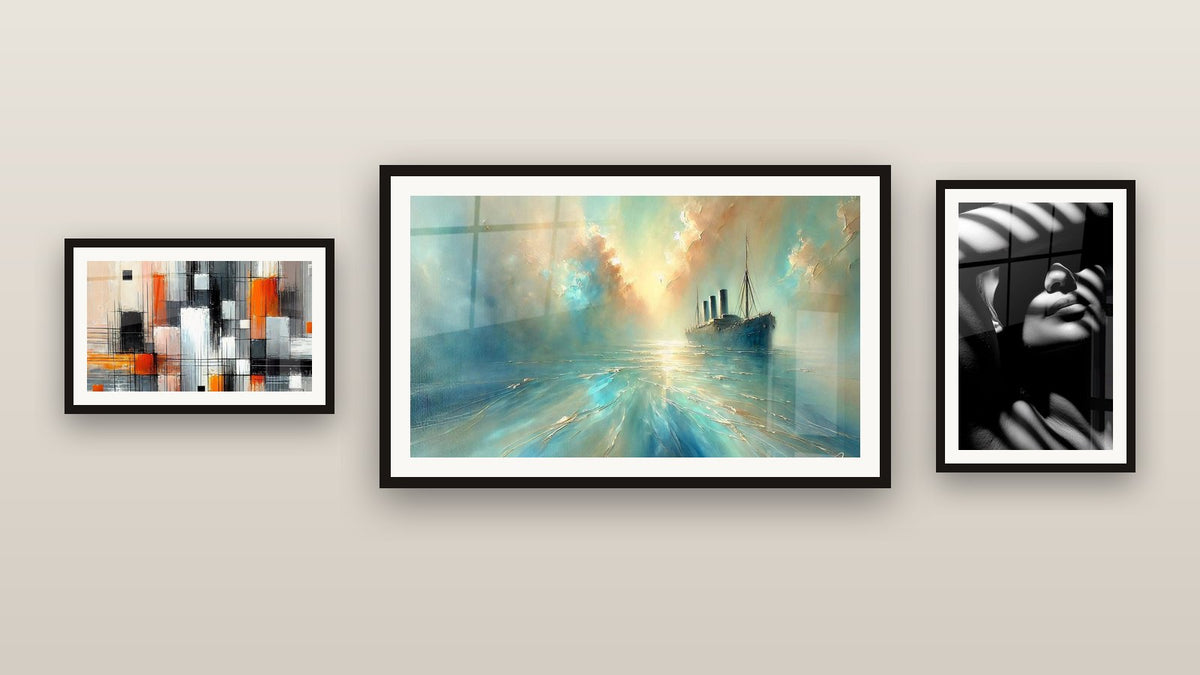 Gallery wall with three framed paintings: Woman Window Shadows, Heart of the Breeze and Mechanics of Colors