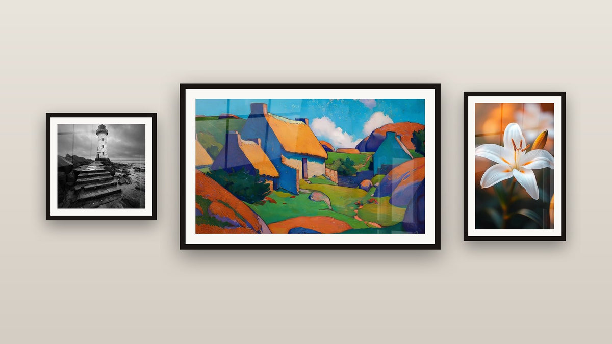 Gallery wall with three framed paintings: Colorful Village, Lighthouse on Jetty and Lily Wall Art N°2
