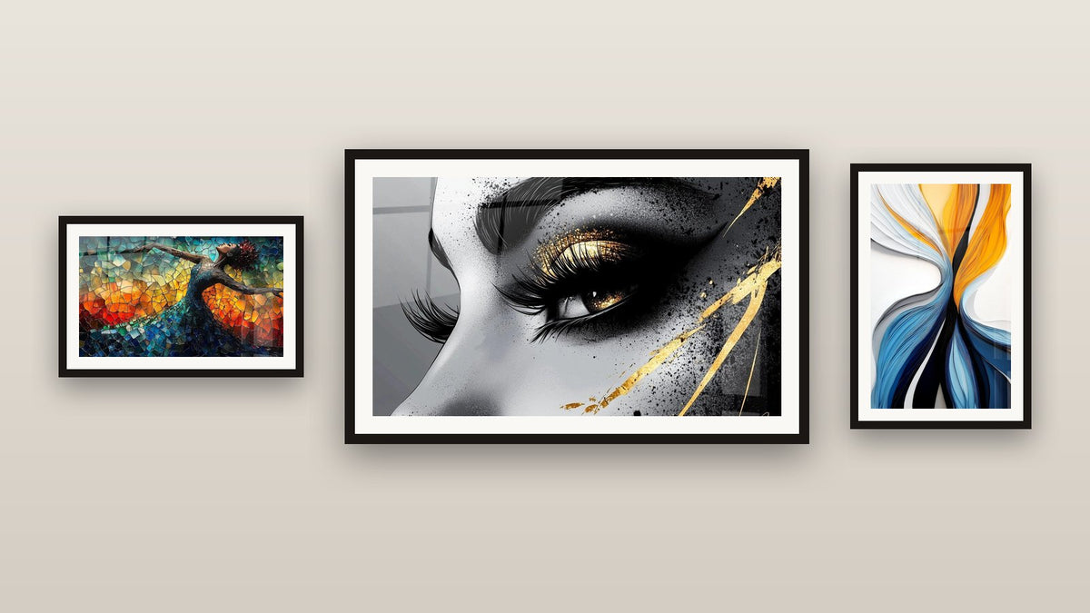 Gallery wall with three framed paintings: Dynamic Colored Flows, Golden Tear Eye and Dance Fire Liberation Red