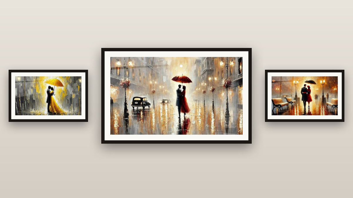 Mur de galerie avec trois tableaux encadrés : Sous le Parapluie Rouge, Amour sous la Pluie et Amour N°3