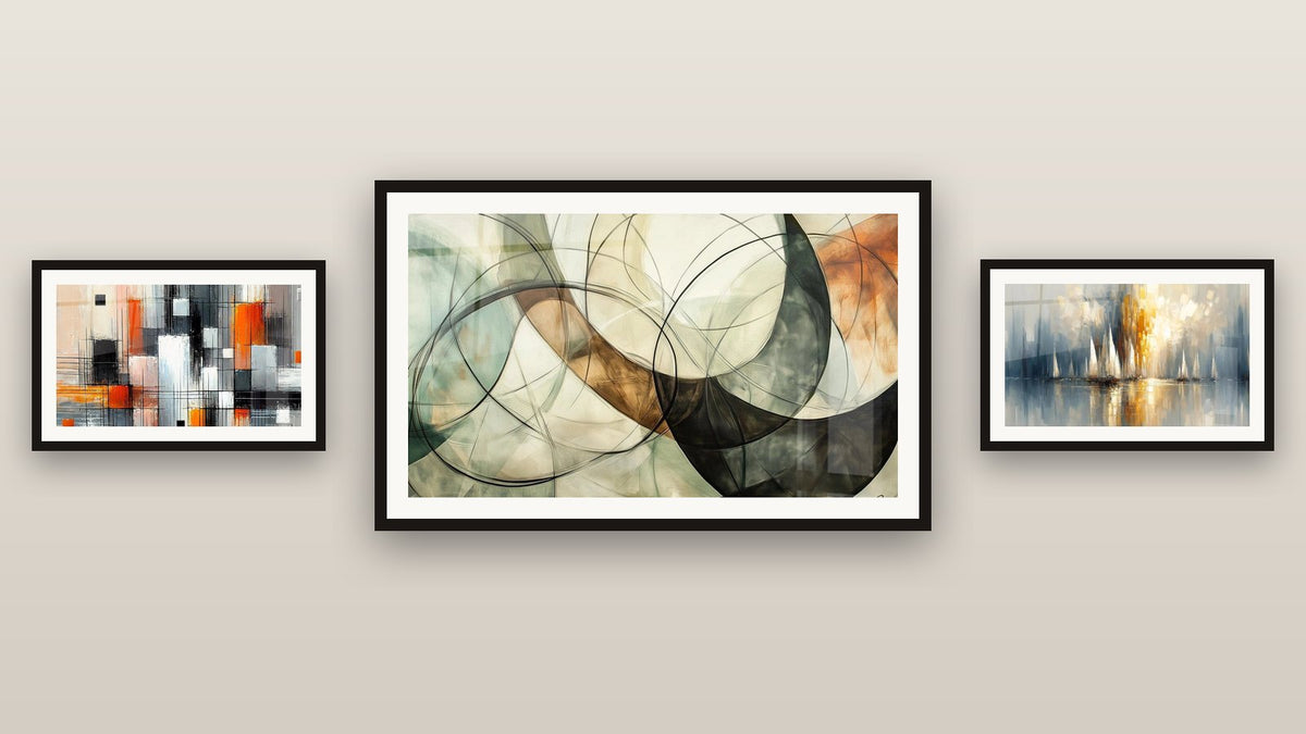Gallery wall with three framed paintings: Mechanics of Colors, Dawn Over the Bay and The Invisible Bonds