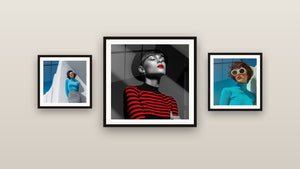 Gallery wall with three framed paintings, including Woman with Black Hat and Red Stripes