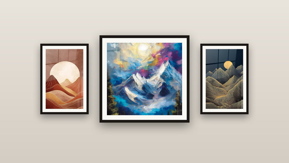 Gallery wall with three framed paintings: Snow-Capped Mountains, Mountain Landscape and Mountain Art Deco