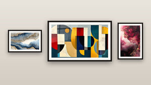 Gallery wall with three framed paintings, including Blue-Gold Undulating Veined and Colored geometric shapes
