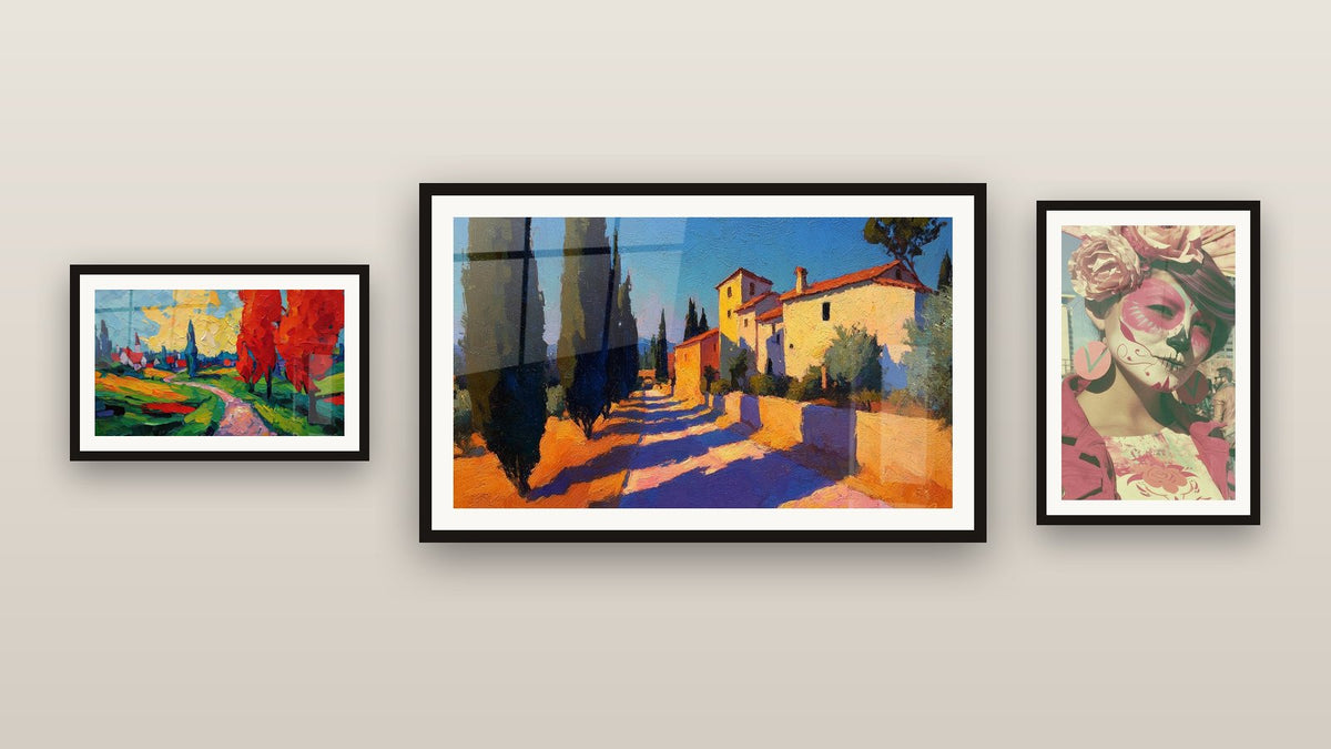 Gallery wall with three framed paintings, including Colorful rural landscape and Mediterranean village