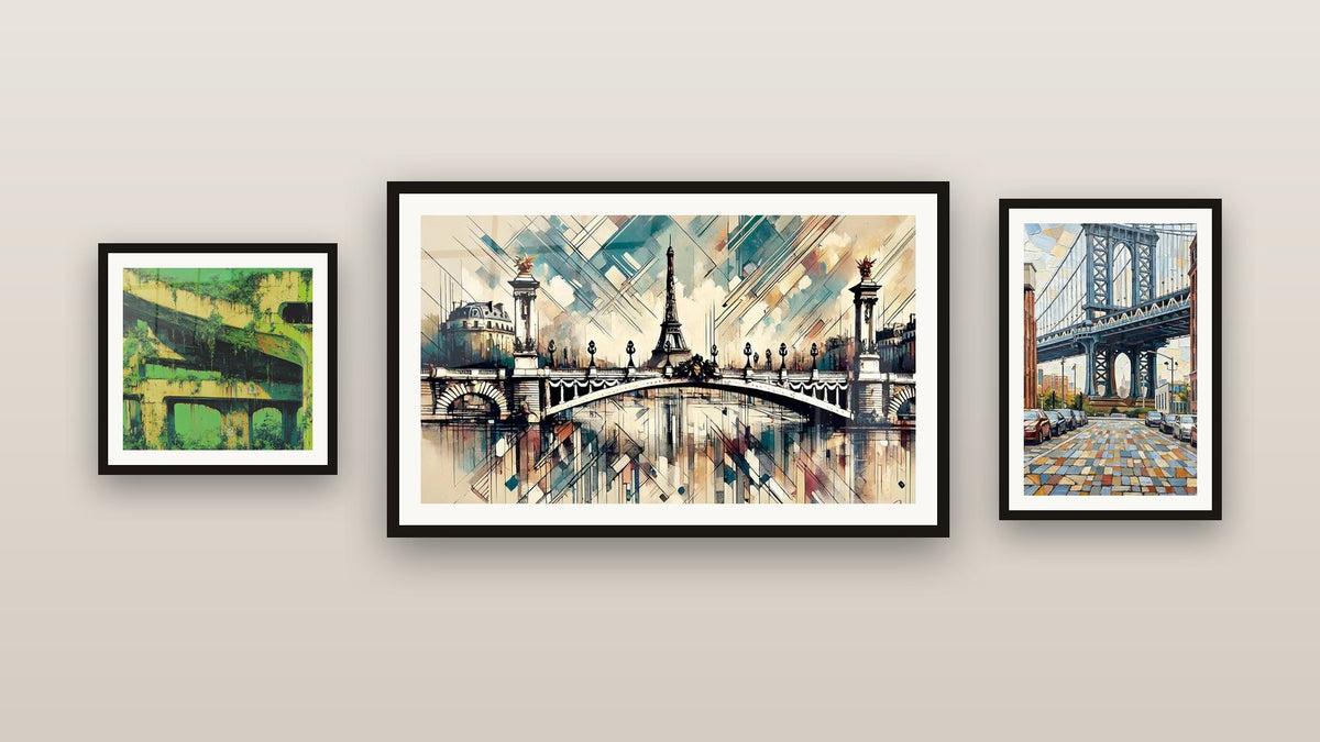 Pared de galería con tres cuadros enmarcados, entre ellos Puente Alejandro III N°2 y Infraestructura Urbana