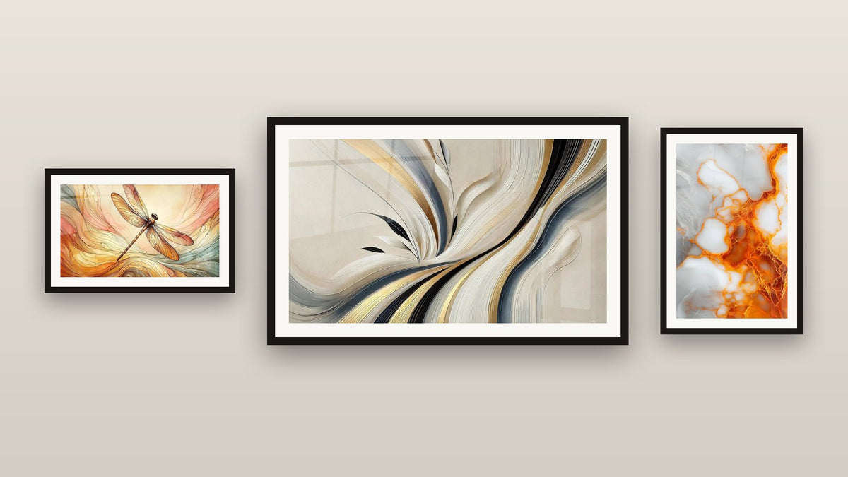 Gallery wall with three framed paintings: Orange and White Veins on Grey Background, Harmony Flow and Aerial Dance
