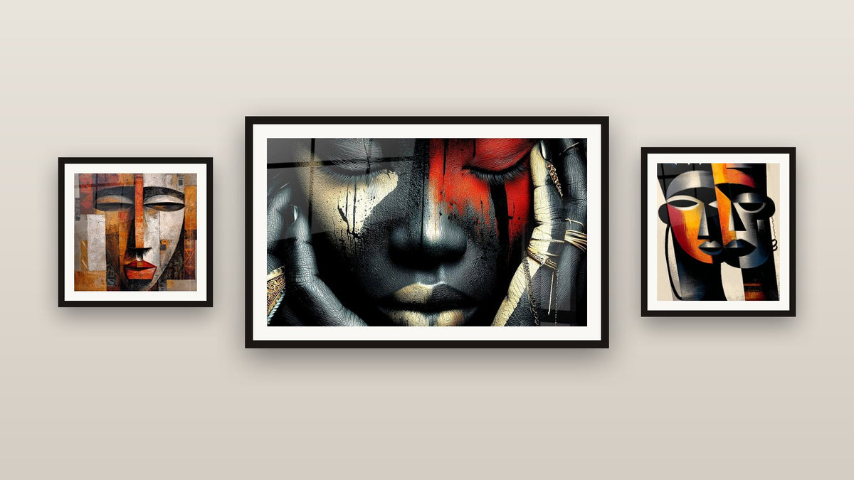 Gallery wall with three framed paintings, including African Masks and Cubist Tribal Mask