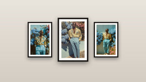 Gallery wall with three framed paintings, including Of Round Gold Glasses, Yellow and Sky Blue