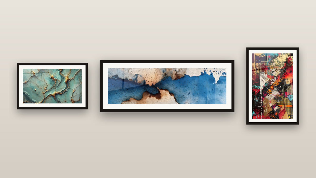 Gallery wall with three framed paintings: Golden Rivers, Urban collage and Blue and beige abstract