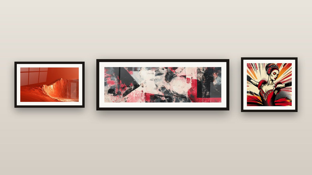 Gallery wall with three framed paintings, including Red and black abstract composition and Red and Orange Rocky Ridge