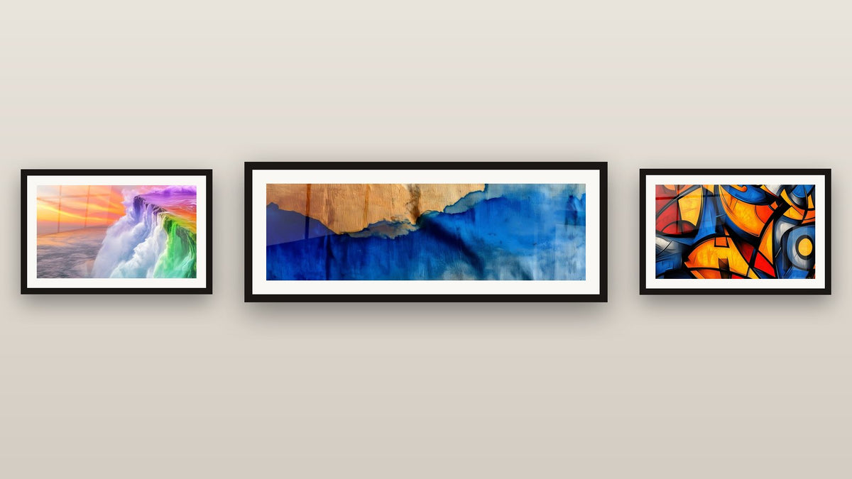 Gallery wall with three framed paintings: Blue Waves and Wood, Rainbow Waterfall and Colored geometric shapes