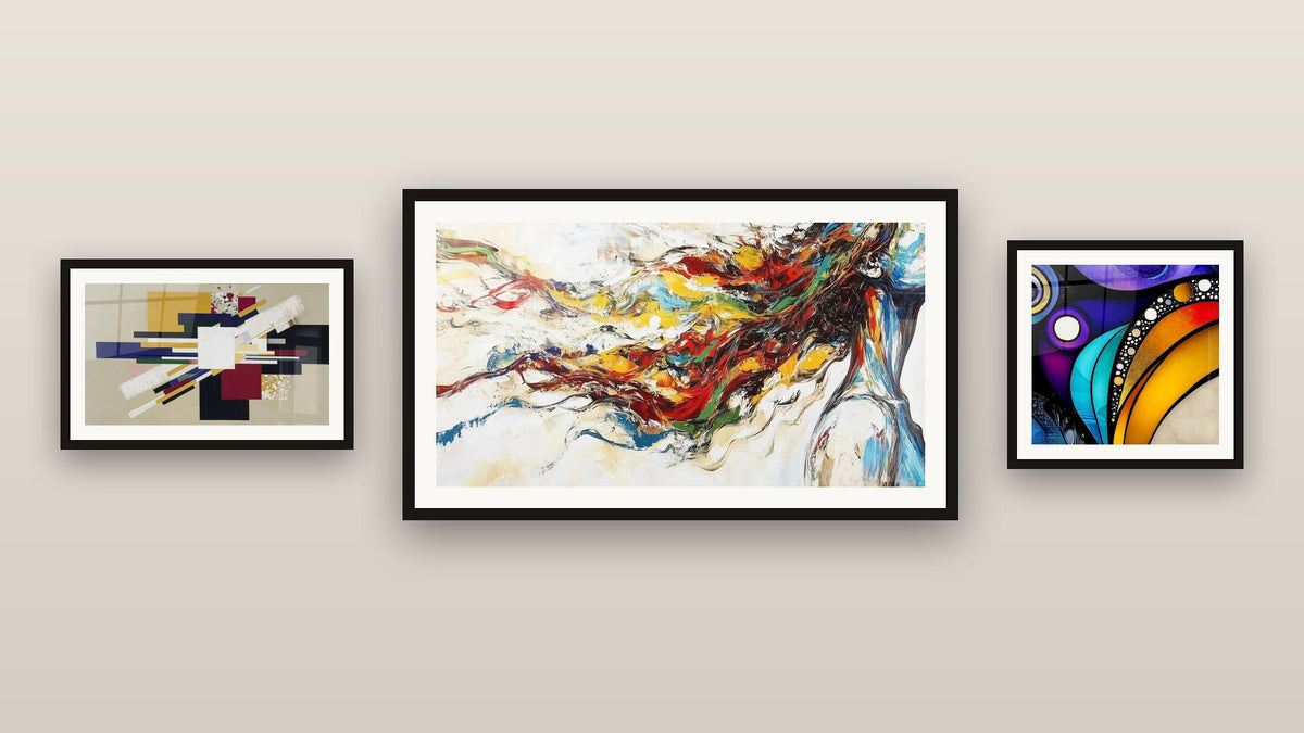 Gallery wall with three framed paintings, including Contemporary Abstract and Modern Muse