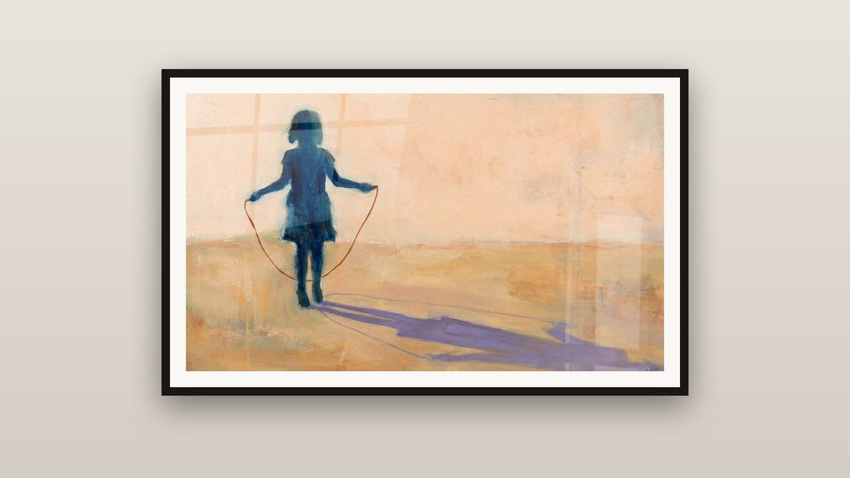 Tableau encadré sur un mur : Enfant Corde à Sauter