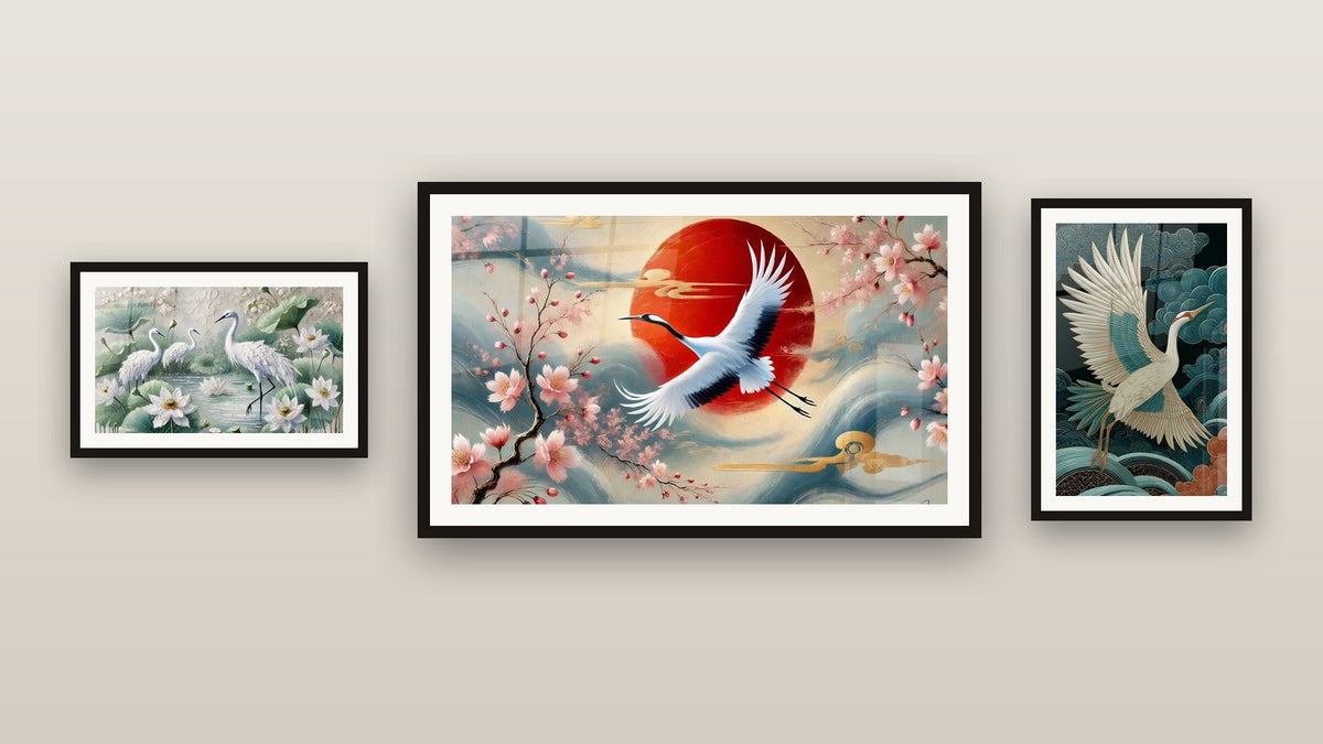 Gallery wall with three framed paintings: Crane in Flight, Under Japan's Sky and Lotus Dance
