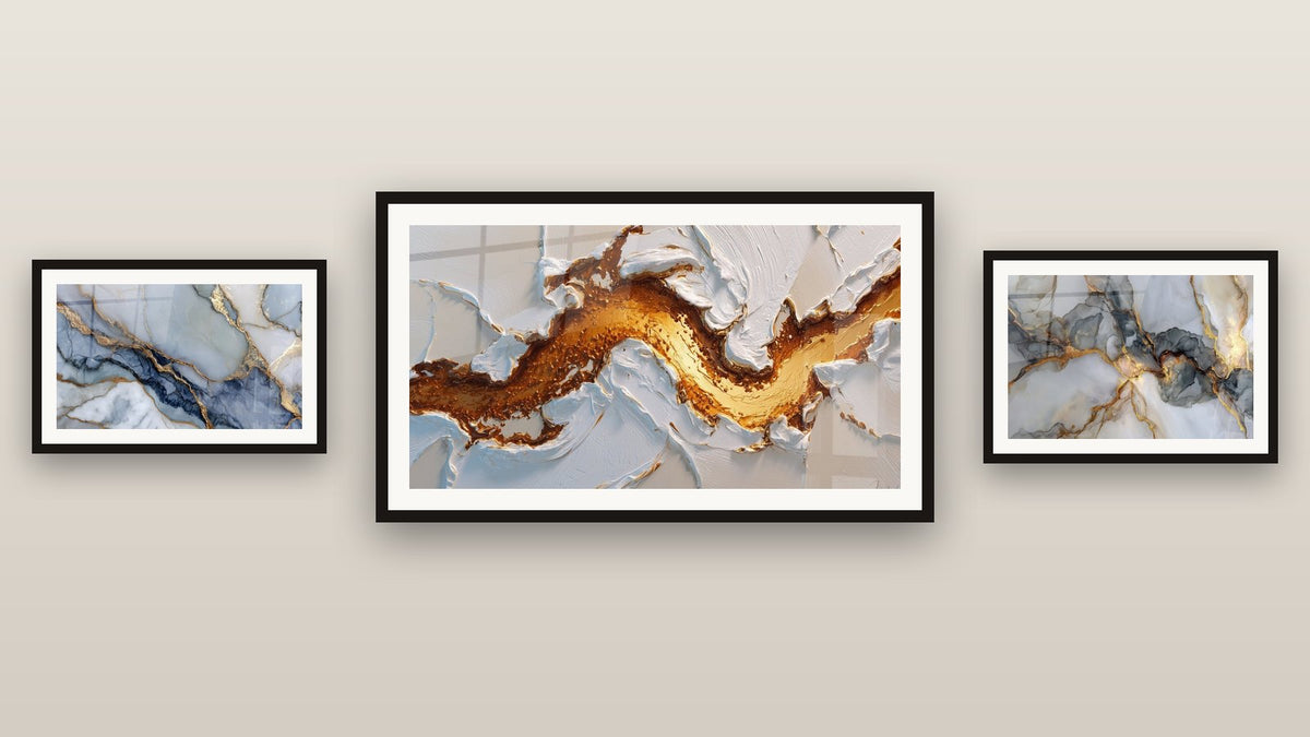 Gallery wall with three framed paintings, including With Golden Veins on Blue-Gray Background