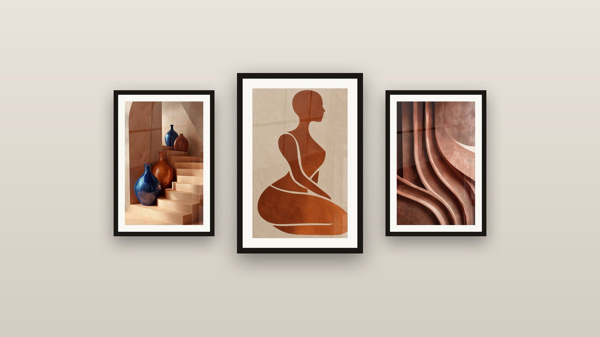 Gallery wall with three framed paintings, including Sculpted Swirling Reliefs Ochre and Brown