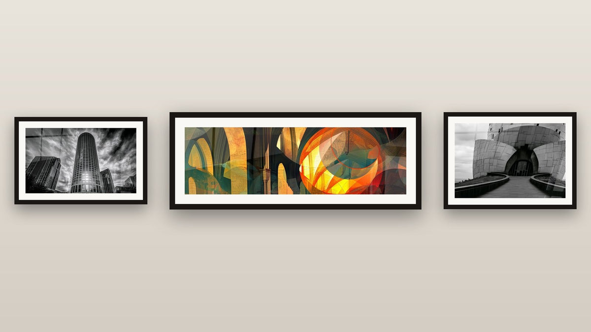 Gallery wall with three framed paintings, including Abstract Gothic architecture