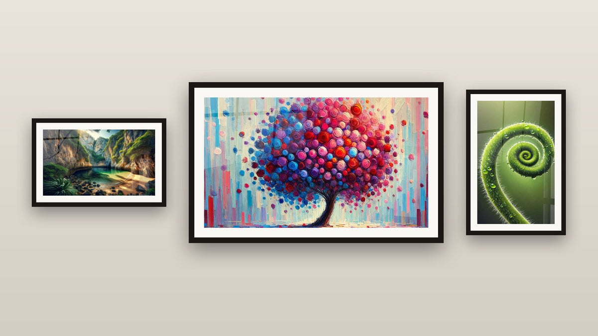 Gallery wall with three framed paintings: Joy Tree, Spiral of Life and Hidden Oasis Landscape