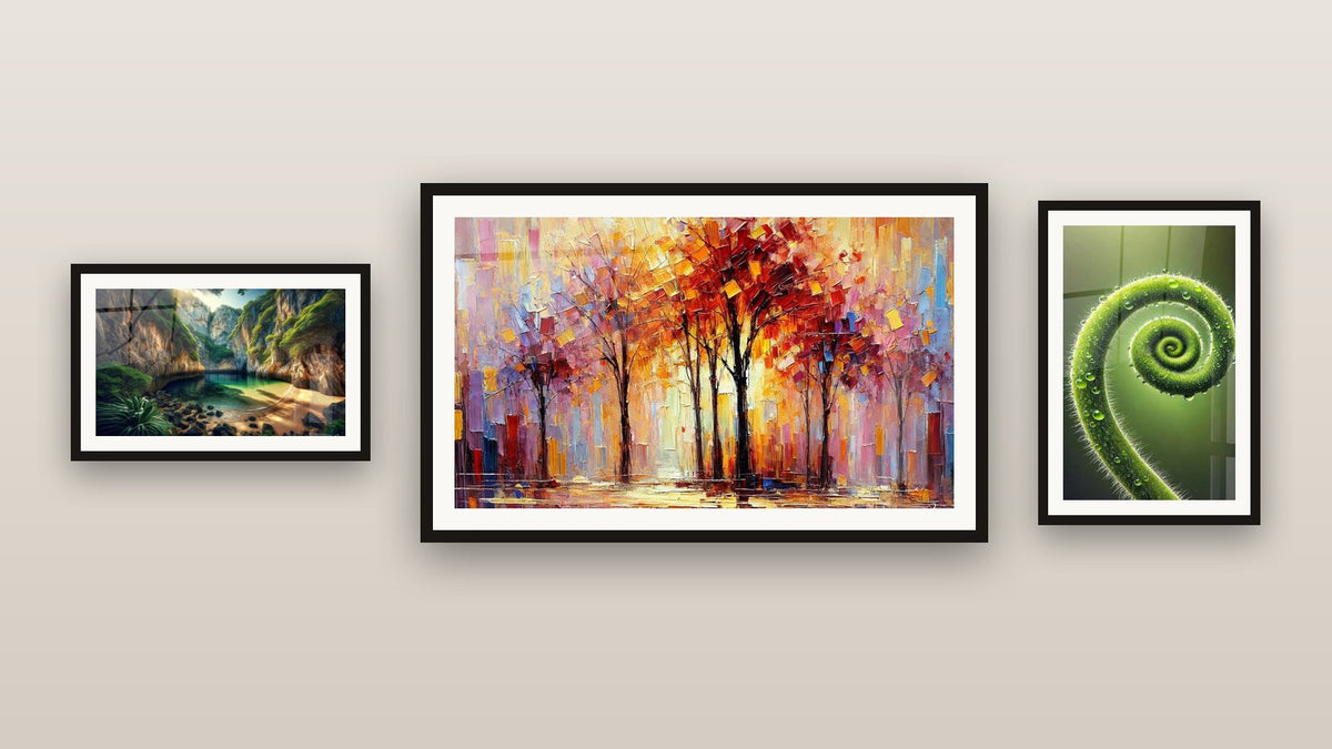 Gallery wall with three framed paintings: Spiral of Life, Hidden Oasis Landscape and Autumn Symphony