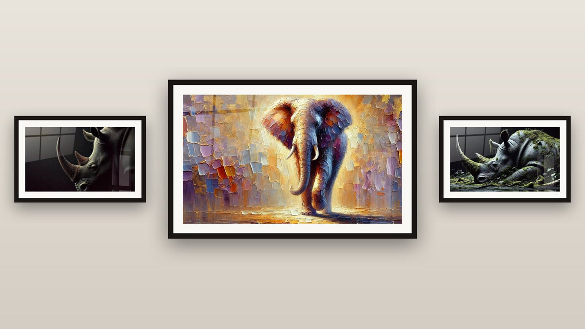 Gallery wall with three framed paintings: Power at Dawn, The Last Colossus and Light Colossus
