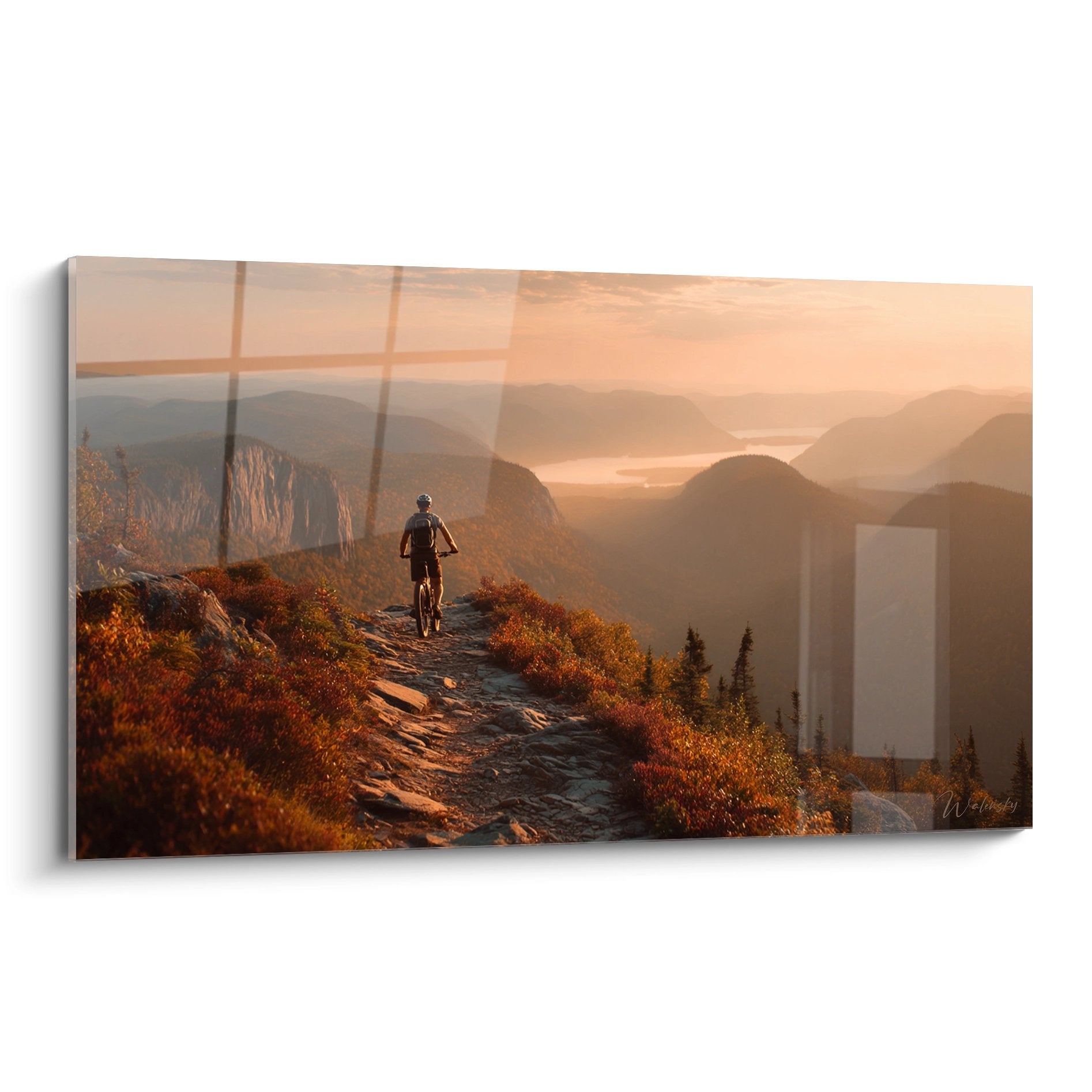Tableau mural VTT montrant cycliste sur sentier montagne au coucher de soleil avec vegetation automnale doree