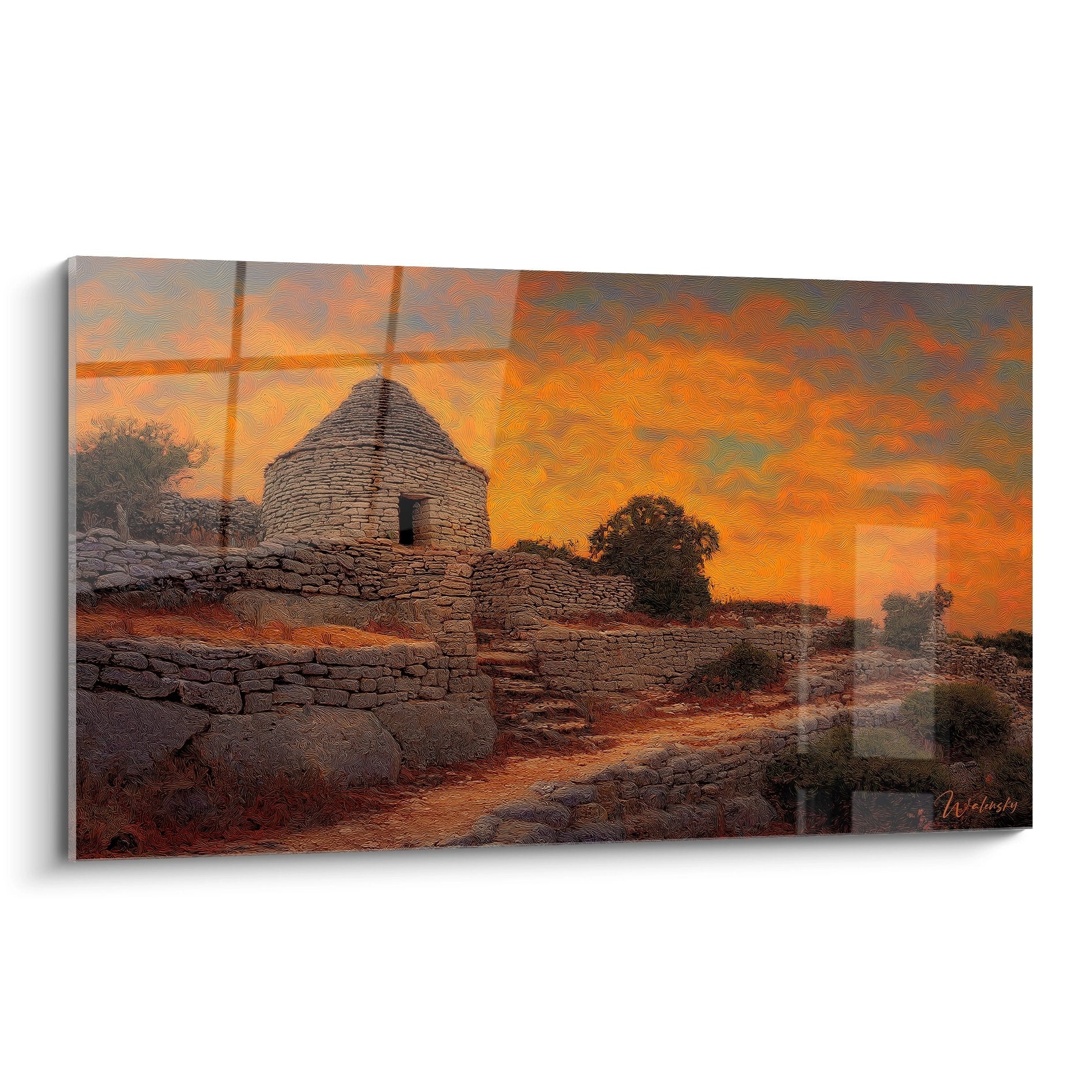 Tableau d'une borie provençale en pierre sèche au coucher du soleil avec ciel orange et terrain rocailleux