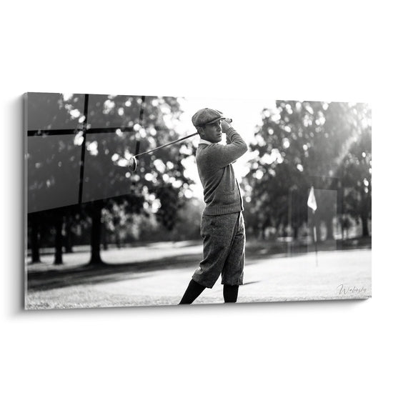 Vintage black and white golf artwork featuring a golfer in classic attire performing an elegant swing