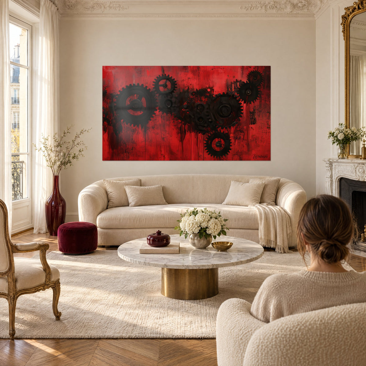 Wall art with black cogwheels on scarlet red background, vertical paint drips, above a sofa in a bright living room