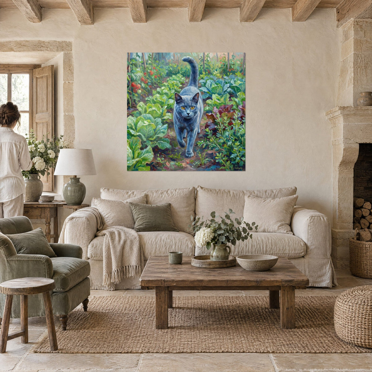 Wall art blue-grey Chartreux cat with amber eyes walking between green cabbages and red tomatoes, above a sofa in a bright living room