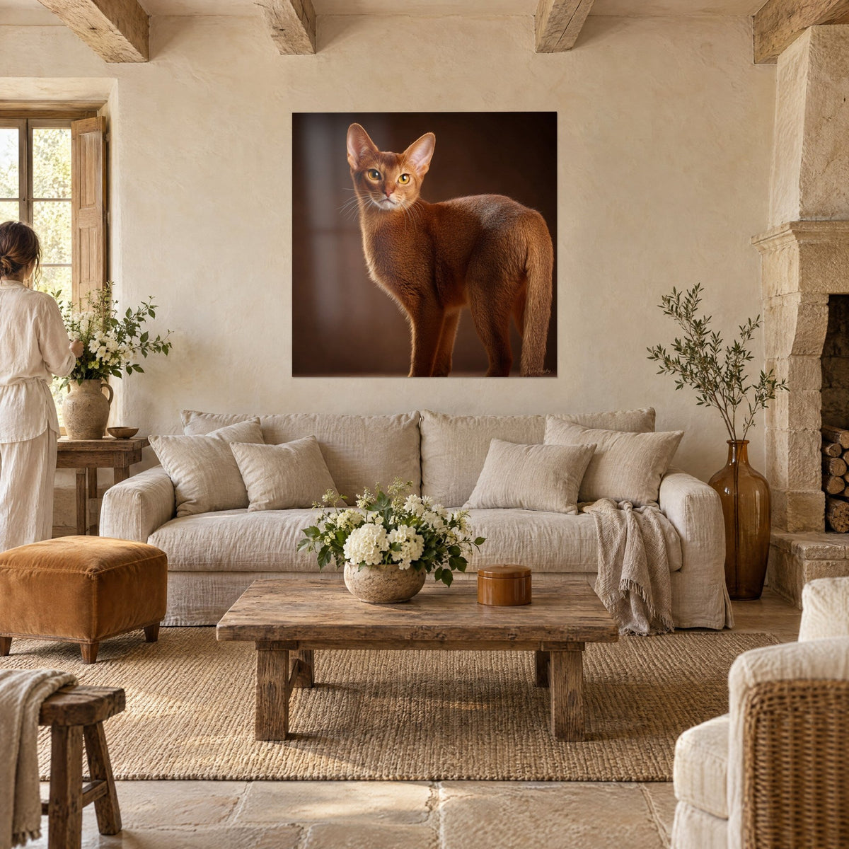 Wall art ginger cat with amber eyes, ears upright on chocolate brown background, above a sofa in a bright living room