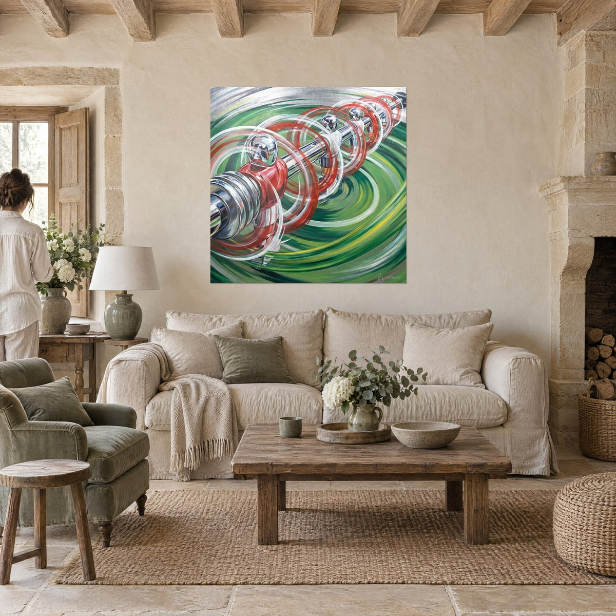 Wall art table football in full spin, chrome rod and red players on a green swirl, above a sofa in a bright living room