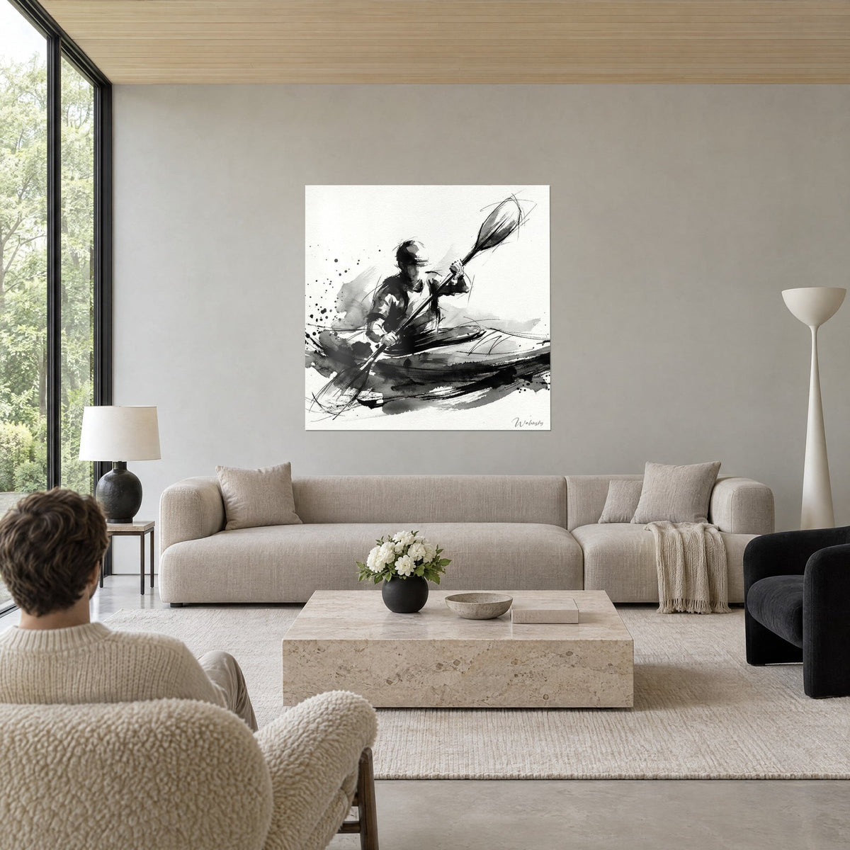 Gemälde eines Kajakfahrers mit schwarzer Tusche beim Paddeln auf cremefarbenem Grund, graue Spritzer, über einem Sofa in einem hellen Wohnzimmer