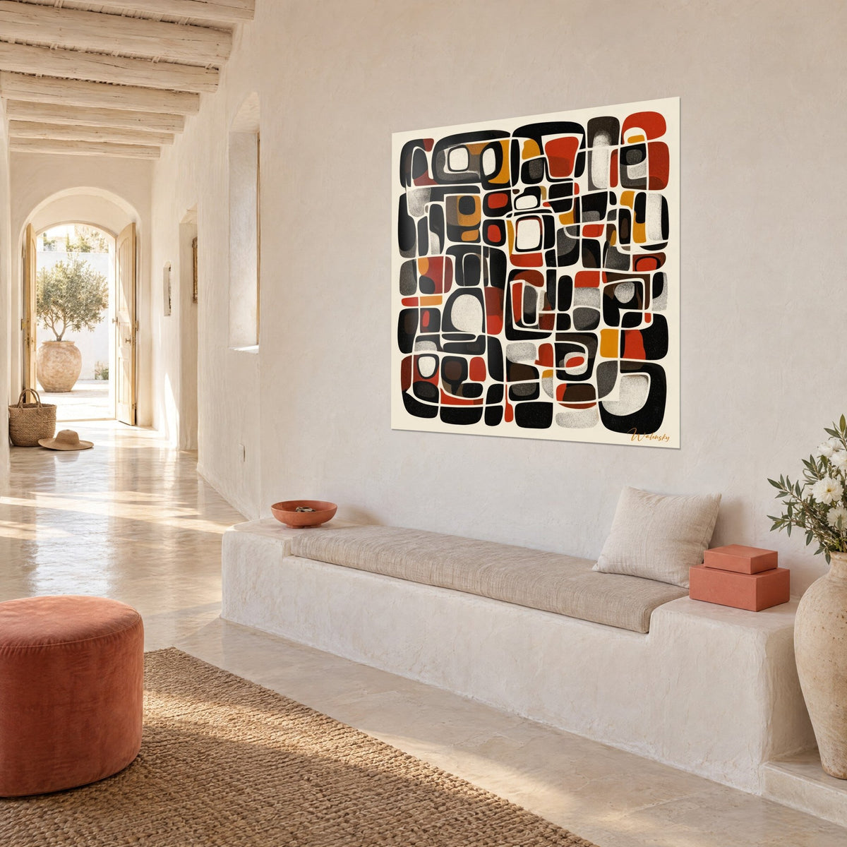Wall art abstract tribal motifs in black, terracotta and mustard, three-quarter view on a white wall, stone bench