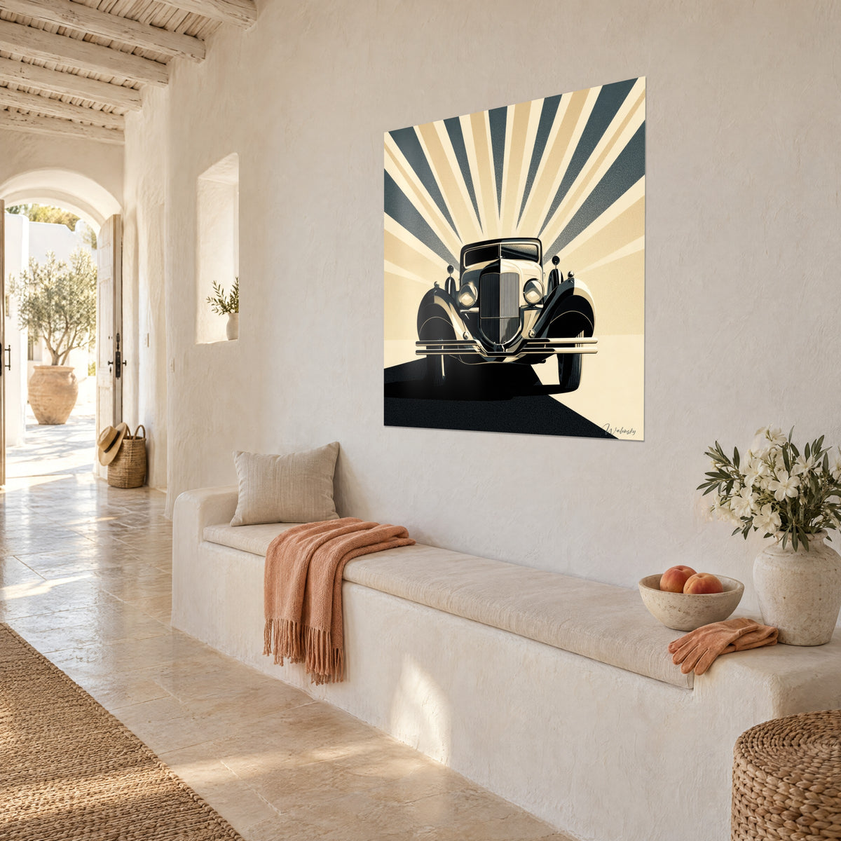 Wall art of a vintage car seen from the front, curved black fenders and cream spoked wheels, white wall of a Mediterranean house