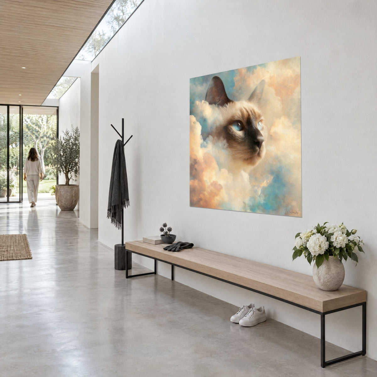 Wall art feline portrait with beige coat and brown mask, peach and turquoise clouds painted in oil, white wall of a glazed hallway