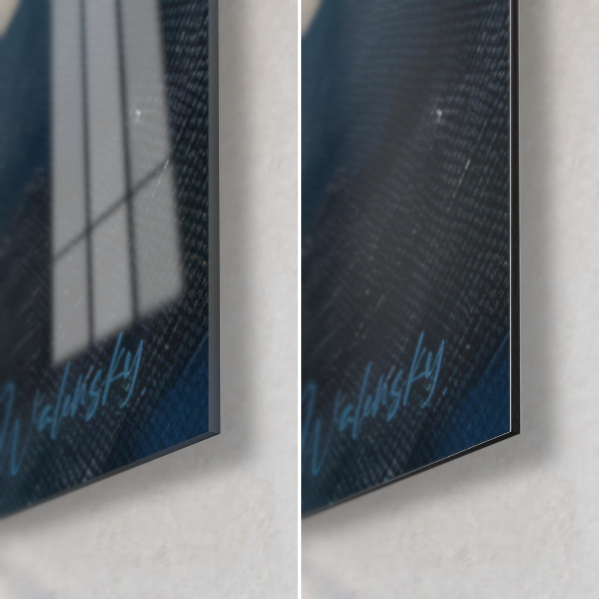 Wall art of an underwater diver in a dark wetsuit, bottom right corner, light blue signature, glossy glass reflecting the window and matte black Dibond