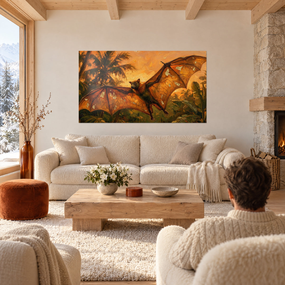 Wall art fruit bat with taut ochre wings, scattered gold leaves against a backdrop of green palm trees, above a sofa in a bright living room