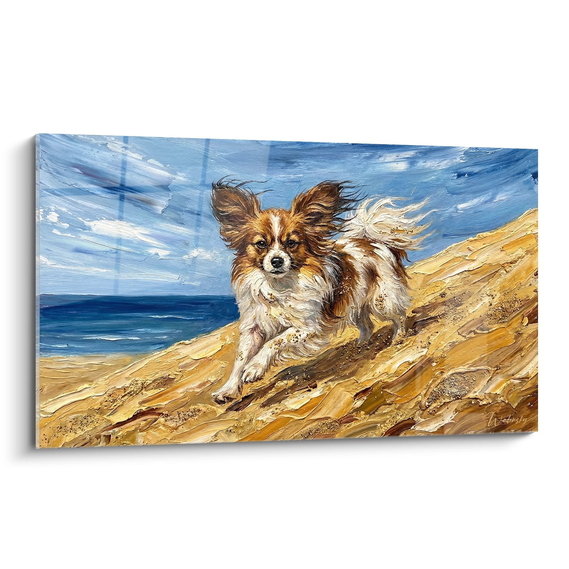 Tableau chien papillon tricolore courant sur plage dorée avec oreilles au vent et océan bleu en arrière-plan