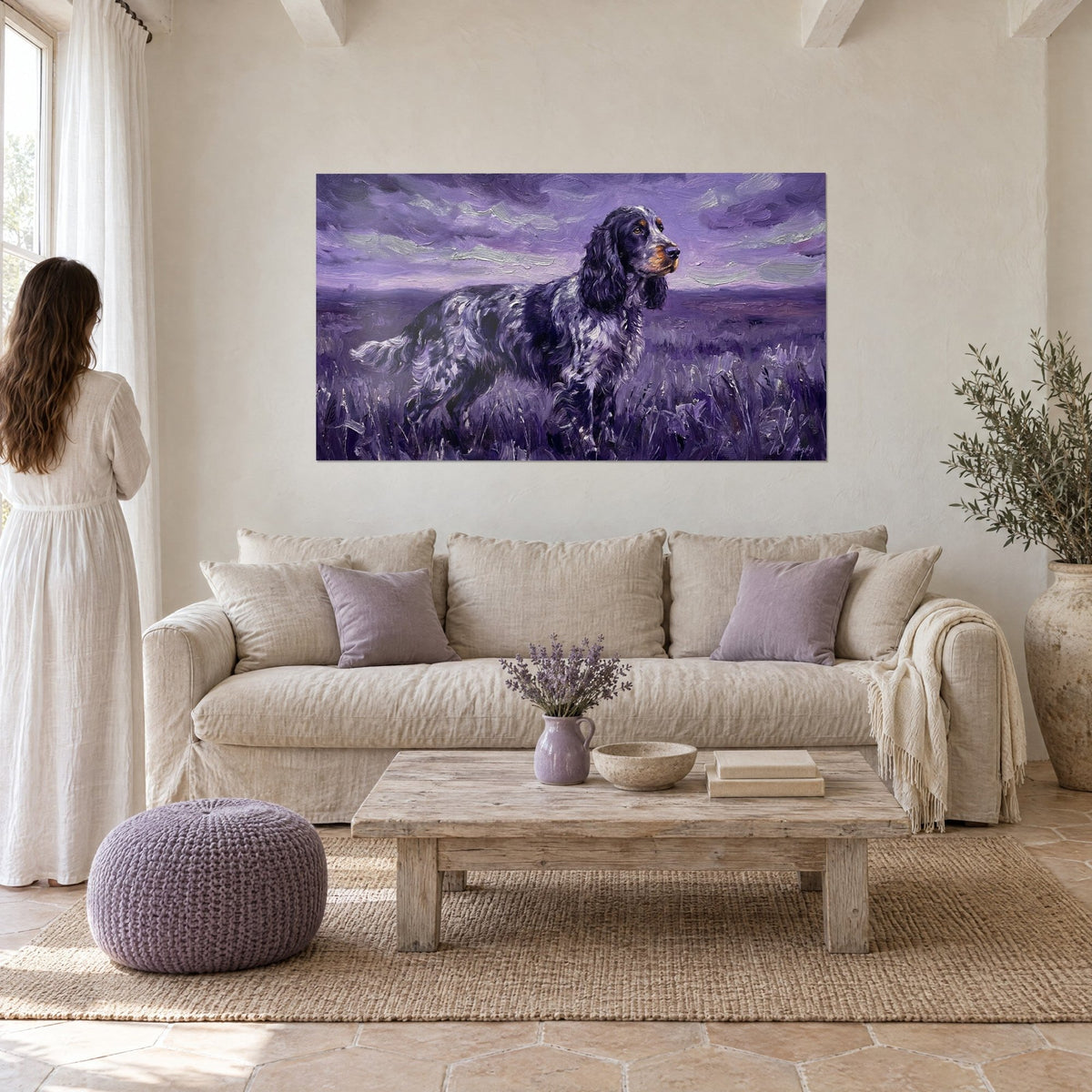 Wall art of a blue roan spaniel standing in the moorland, lilac sky streaked with clouds, above a sofa in a bright living room