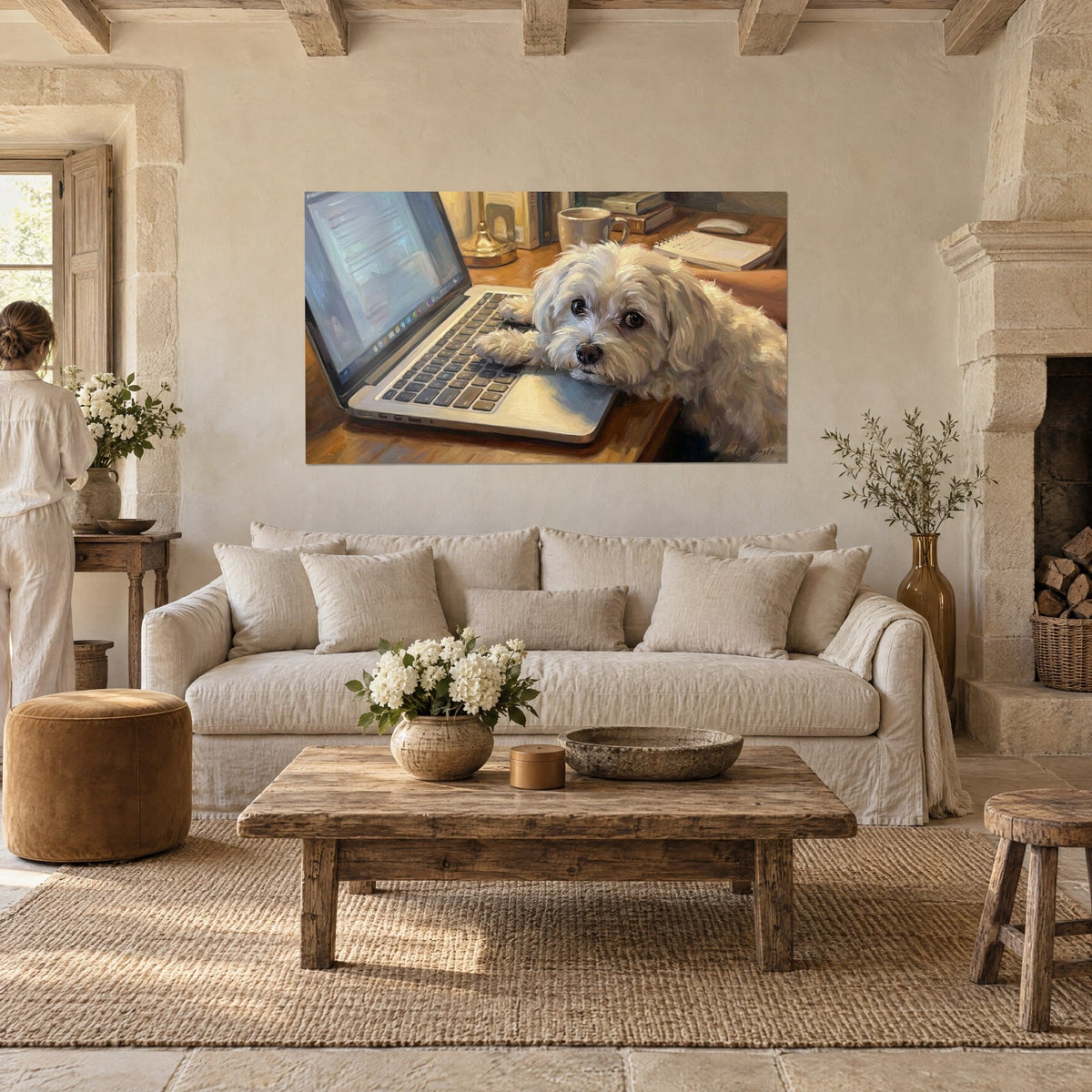Wall art of a cream-coated Maltese bichon, muzzle resting on a grey keyboard and a beige mug, above a sofa in a bright living room