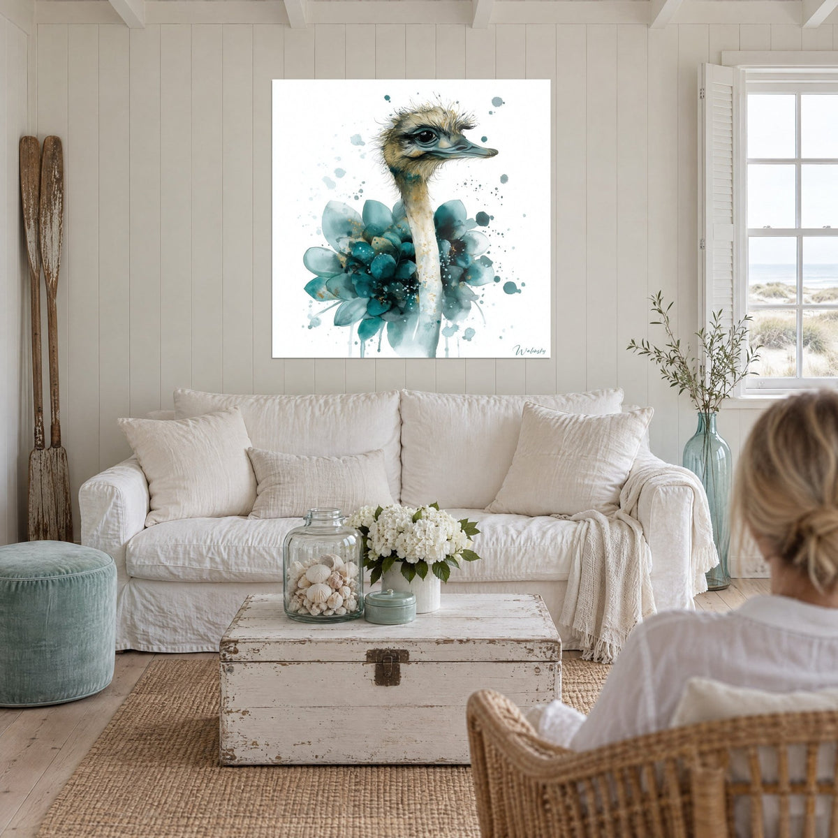 Wall art ostrich in watercolor, cream neck and turquoise and teal petal collar, above a sofa in a bright living room