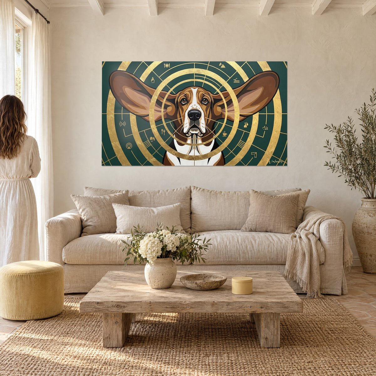 Wall art basset hound with long brown ears spread over gold and fir green circles, above a sofa in a bright living room
