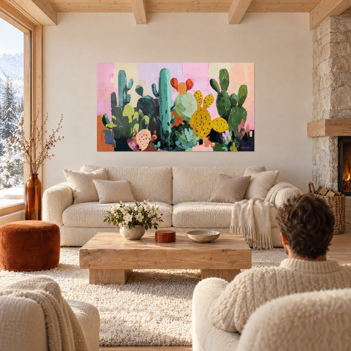 Gemälde Kaktusgarten mit Messerspachtel-Technik, senfgelbe und salbeigrüne Kakteenglieder auf rosa Pastellhintergrund, über einem Sofa in einem hellen Wohnzimmer