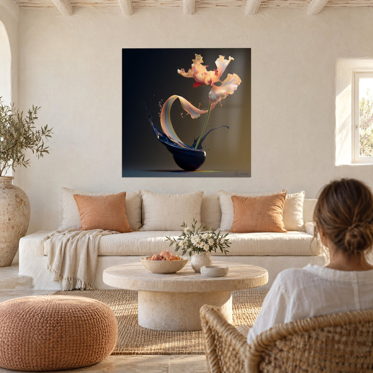 Wall art orange and pink parrot tulip in motion, splashed navy blue ink, above a sofa in a bright living room