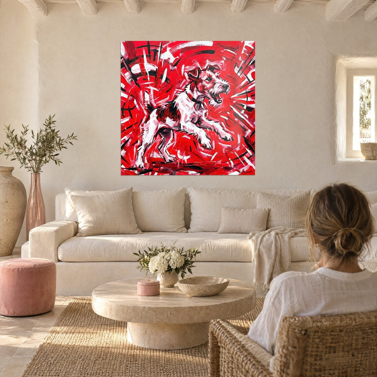 Wall art white fox terrier barking on bright red background, bold black brushstrokes, above a sofa in a bright living room