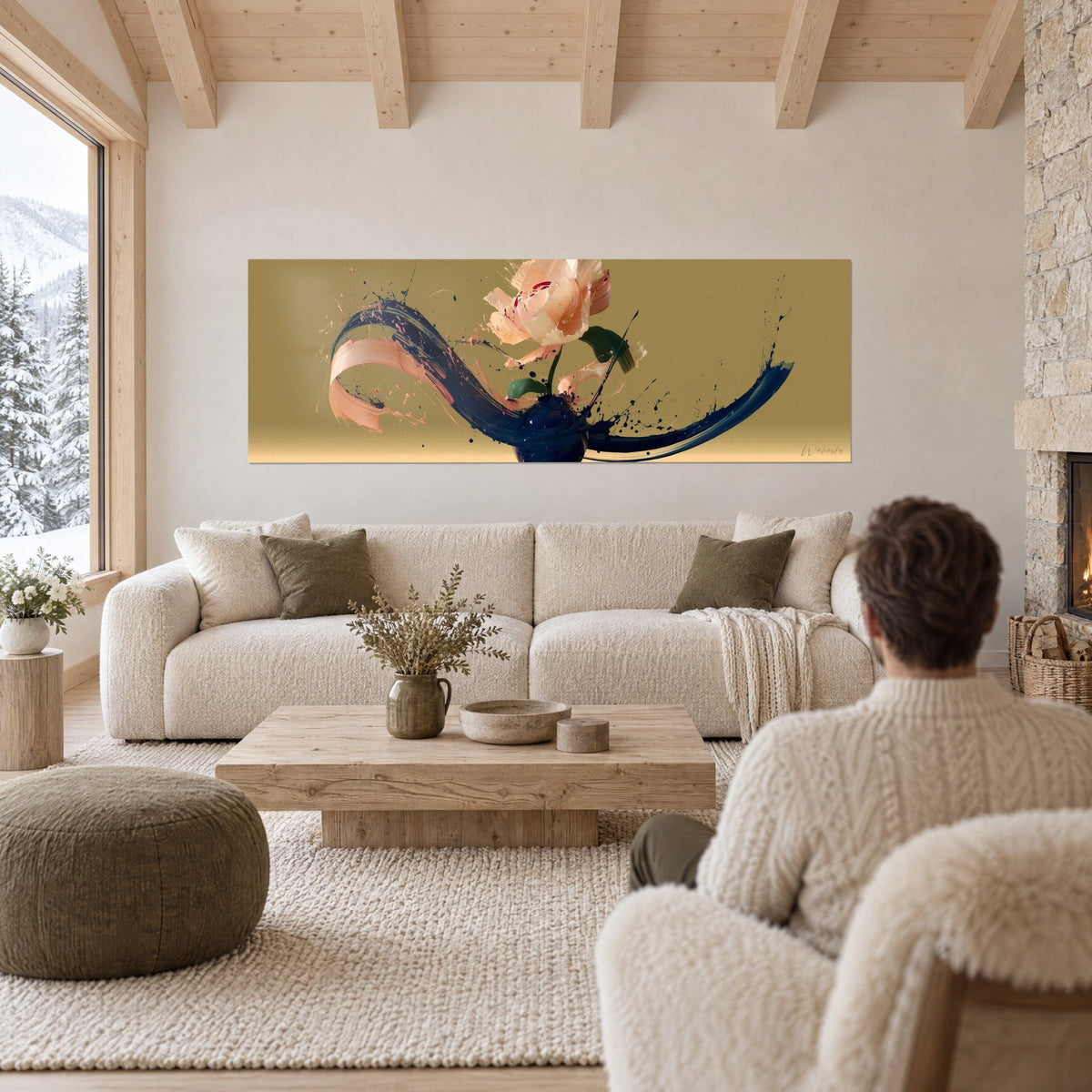 Wall art peony in peach splashed with midnight blue on an ochre background, a man seen from behind above a sofa in a bright living room
