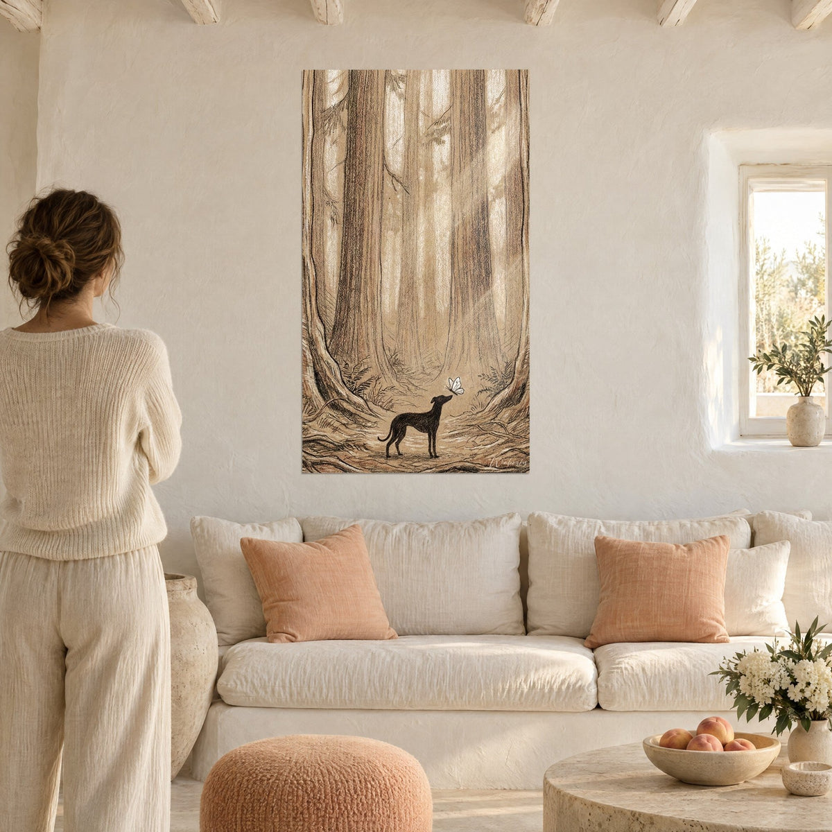 Wall art black greyhound facing a white butterfly, beige and sepia redwood forest, above a sofa in a bright living room