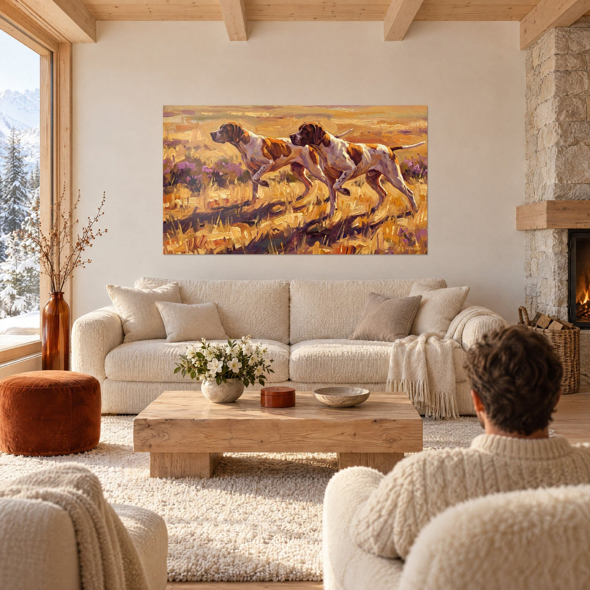 Wall art of two white and brown pointers on point in golden moorland, violet heather accents, above a sofa in a bright living room