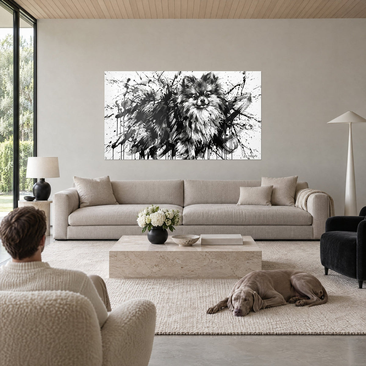 Cuadro de spitz pomerania en tinta negra y blanca, salpicaduras vivas, sobre un sofá en un salón luminoso
